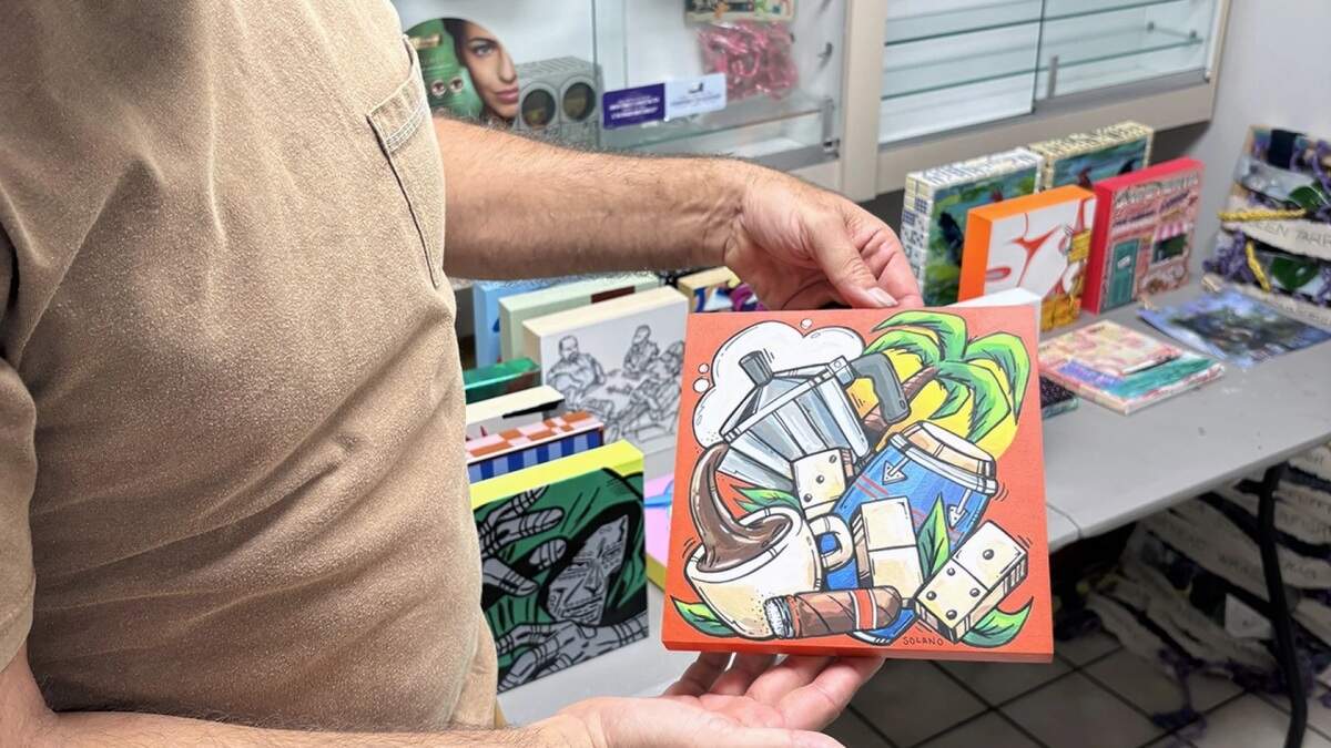 Artist Daniel Fila, better known as Krave, holds one of the 8x8 pieces that’ll be available at El Fresco’s grand re-opening in Little Havana on Tuesday, Sept. 8, 2026.
